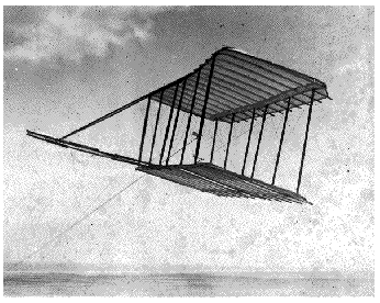 Here is a photo taken in 1900 of the actual aircraft flying at Kitty Hawk as a kite.