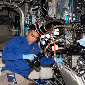 In this Jan. 17 photo [iss066e114301], NASA astronaut Raja Chari is at the Combustion Integrated Rack (CIR) making changes to the Advanced Combustion via Microgravity Experiments (ACME) hardware in preparation for its final days of testing. The ACME insert can be seen partially withdrawn from the CIR combustion chamber.