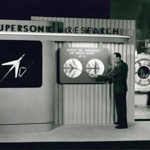 Man with pointer beside before display.