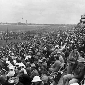 Crowd in outdoor grandstands.