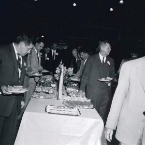 Men at banquet table.