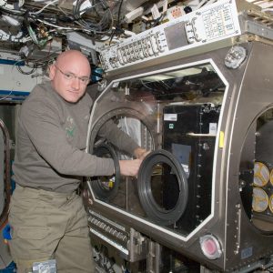 NASA astronaut Scott Kelly, Expedition 26 commander, works with Capillary Channel Flow (CCF) experiment hardware in the Microgravity Science Glovebox (MSG) in the Destiny laboratory of the International Space Station. (NASA)