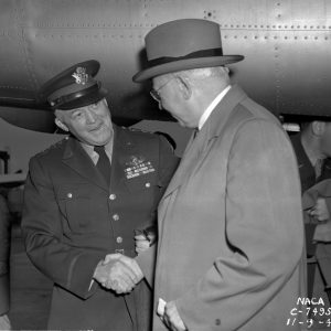 General Arnold and George Lewis shake hands on AERL tarmac