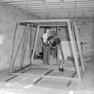 Man with rocket in test cell.