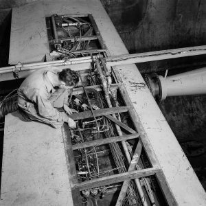 Mechanic with wiring of wingspan crossing test section.