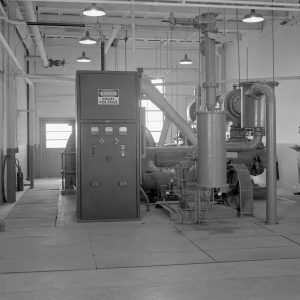 The 500-hp Ingersoll Rand compressor and support equipment in Room 106 of the Jet Propulsion Static Laboratory.