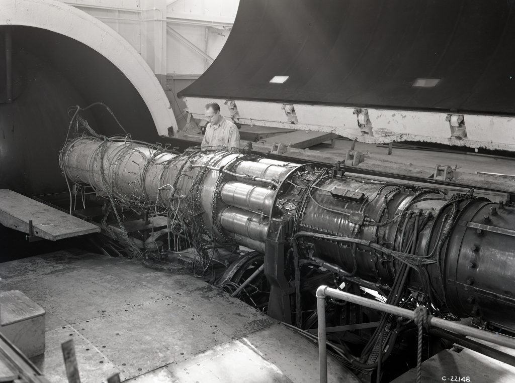 Mechanics work on TG-190 engine in AWT test section.