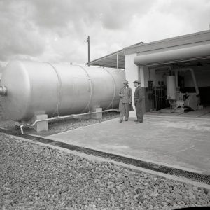 Cylindrical tank beside test cell.