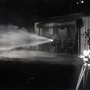 Camera man filming horizontal rocket firing at night