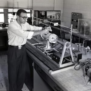 Man with test apparatus.