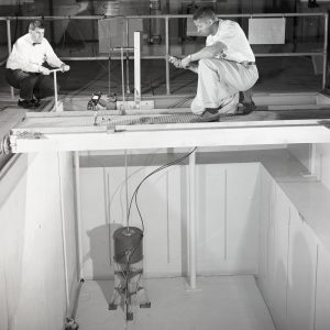Researchers prepare for a test in the gamma radiation pool in a former sping pit (1960)