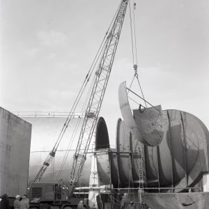 Crane inserts bulkhead into new Space Power Chambers.