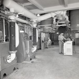 Men working inside Vacuum Pump House.