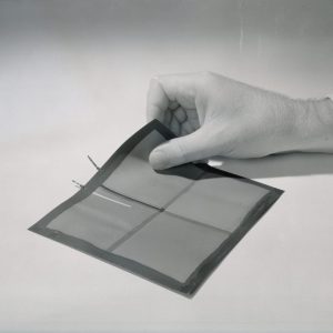 Hand holding solar cell.