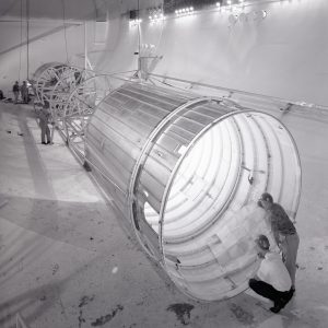 Engineers examine tubular Atlas-Centaur setup inside SPC No. 2.