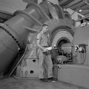 Technician working with exhauster in the PSL Equipment Building.