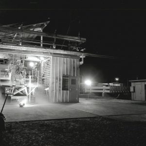 Rocket engine firing horizontally out of J-1 at night