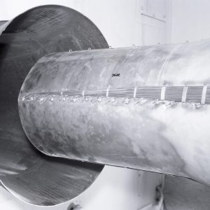 Shroud on the tailpipe of a General Electric J-85 engine installed in Cell 2 (1967)