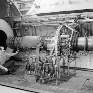 Mechanic with J-85 engine in a PSL test chamber.