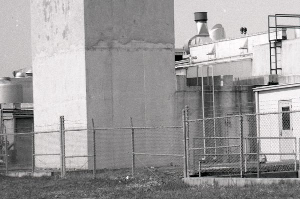 Exhaust stack behind test cell.