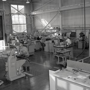 Men working with equipment in shop
