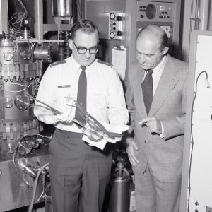 Henry Kosmahl and Air Forc Major Buck with travelling tube test rig (1977).