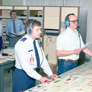 Men at control panel