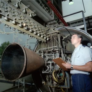 Engineer with horizontal test stand.