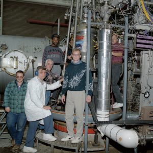 RETF staff examine setup of TRW liquid oxgen/RP-1 engine (12/18/1993).
