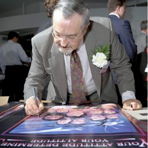 Ostrach signing poster.