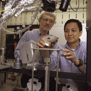 Materials researchers Robert Miller and Dongming Zhu with a laser rig (2003)