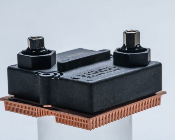 Image of a copper heat exchanger mounted to a resistor