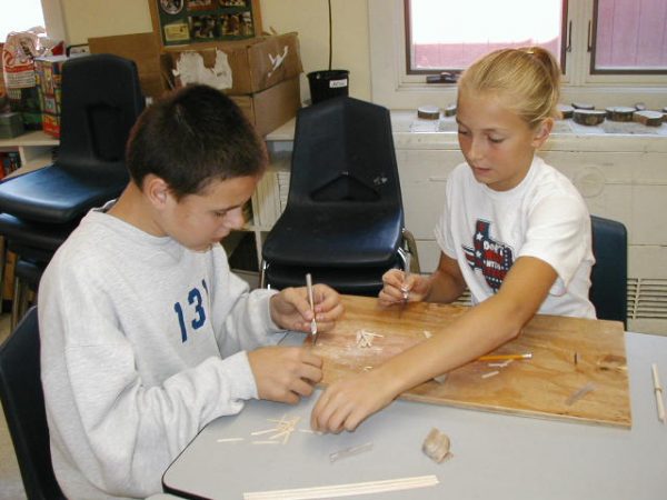 Photo of students working on the Orono replica