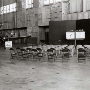 Exhibit in hangar with aircraft.