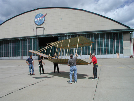 Image of NASA engineers testing the design process of the 1900 aircraft