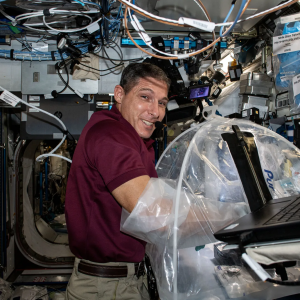 NASA astronaut and Expedition 64 Flight Engineer Michael Hopkins performs an analysis of control blood samples inside a disposable glovebox.