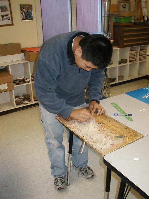 Photo of student working on the Orono replica